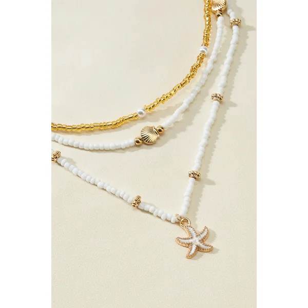 Ensemble de colliers perlés chaînes dorées