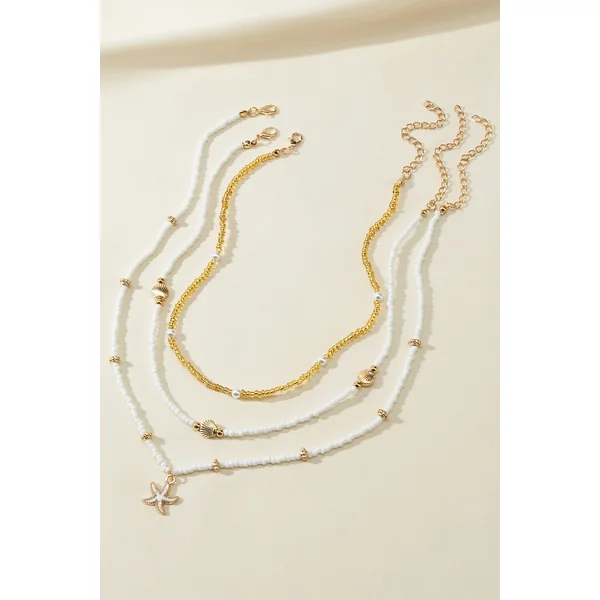 Ensemble de colliers perlés chaînes dorées