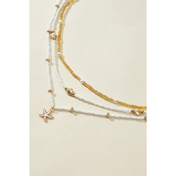 Ensemble de colliers perlés chaînes dorées