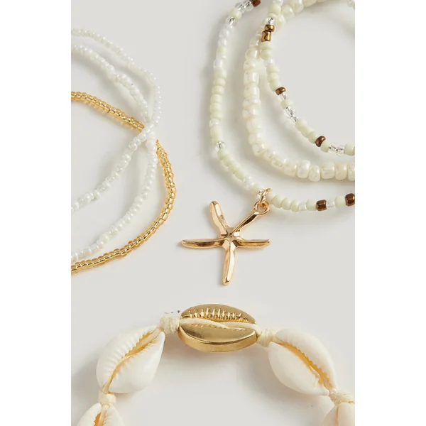 Lot de bracelets perlés à breloques coquillages