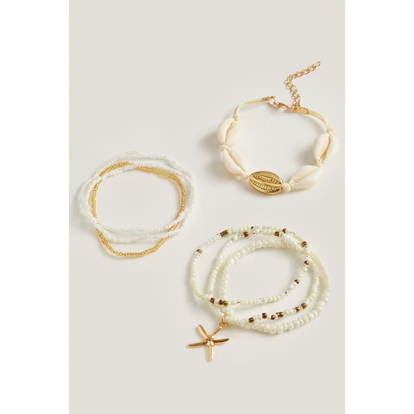 Lot de bracelets perlés à breloques coquillages