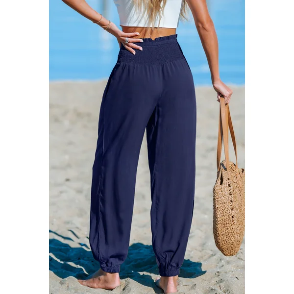 Pantalon bleu jambe fuselée taille smockée
