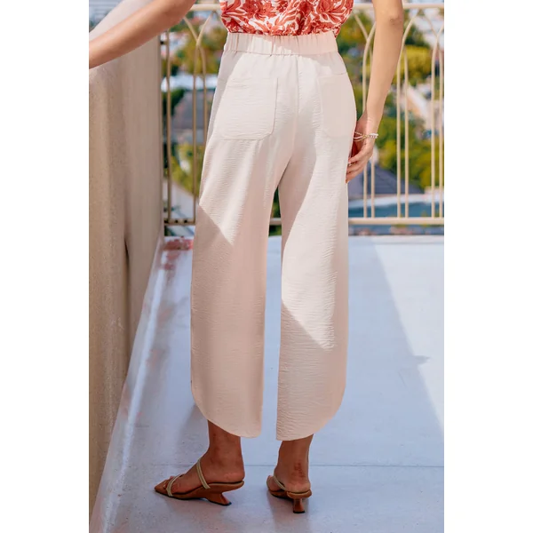 Pantalon crème ourlet incurvé