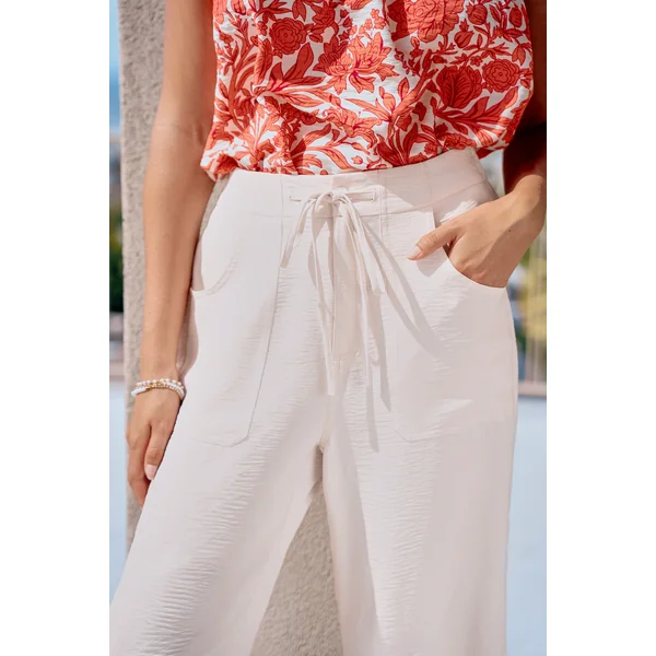 Pantalon crème ourlet incurvé