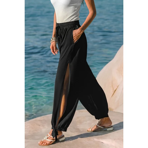 Pantalon noir taille élastique ourlet fendu jambe fuselée