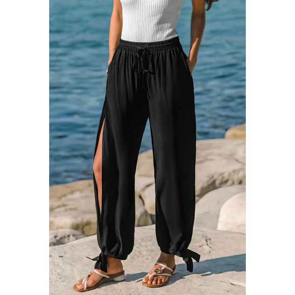 Pantalon noir taille élastique ourlet fendu jambe fuselée