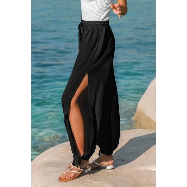 Pantalon noir taille élastique ourlet fendu jambe fuselée