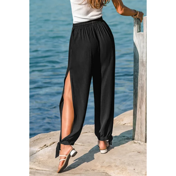 Pantalon noir taille élastique ourlet fendu jambe fuselée