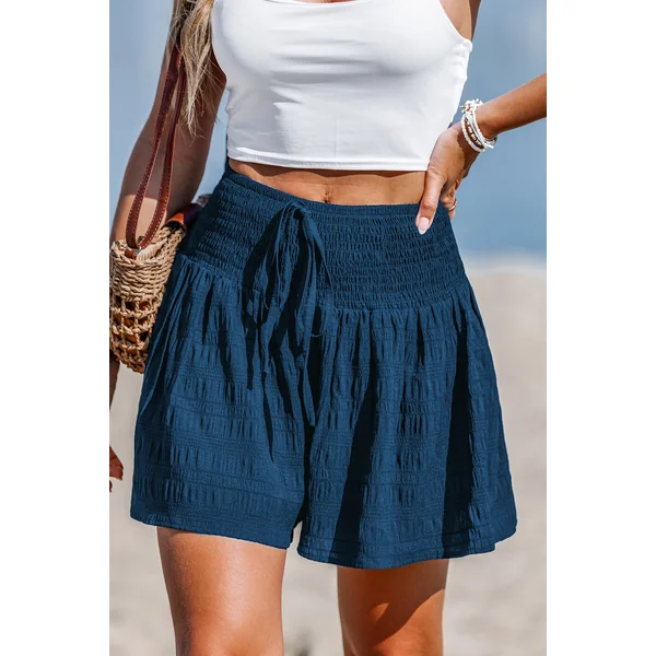 Short bleu à volants taille smockée