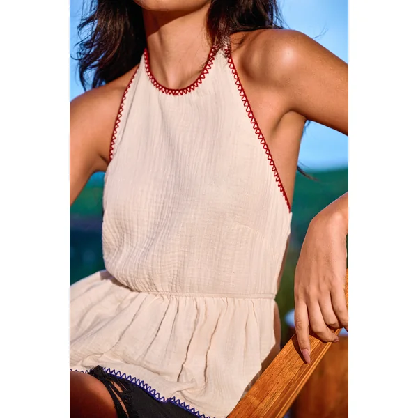 Top beige à péplum